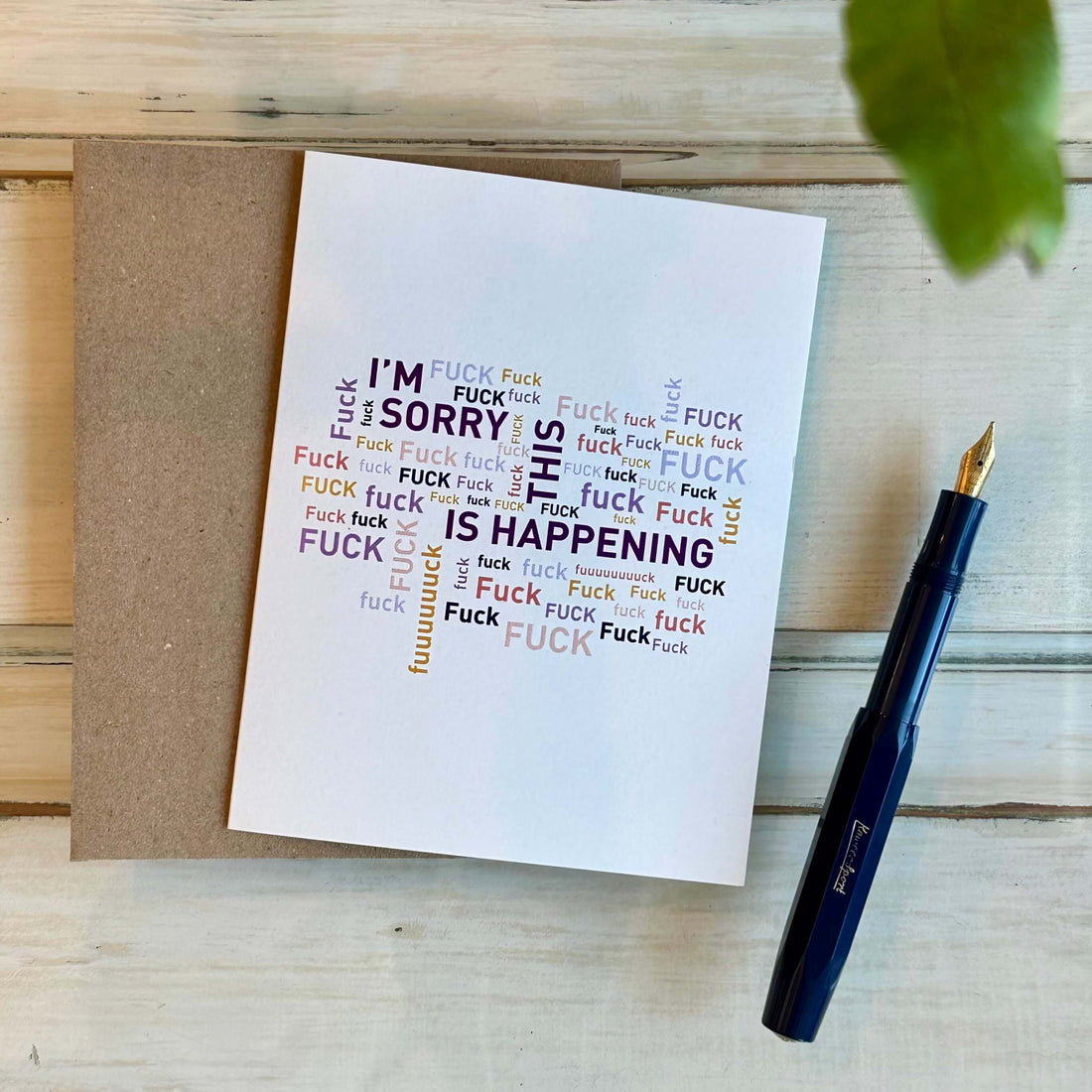 A greeting card with a bold text pattern and the words &