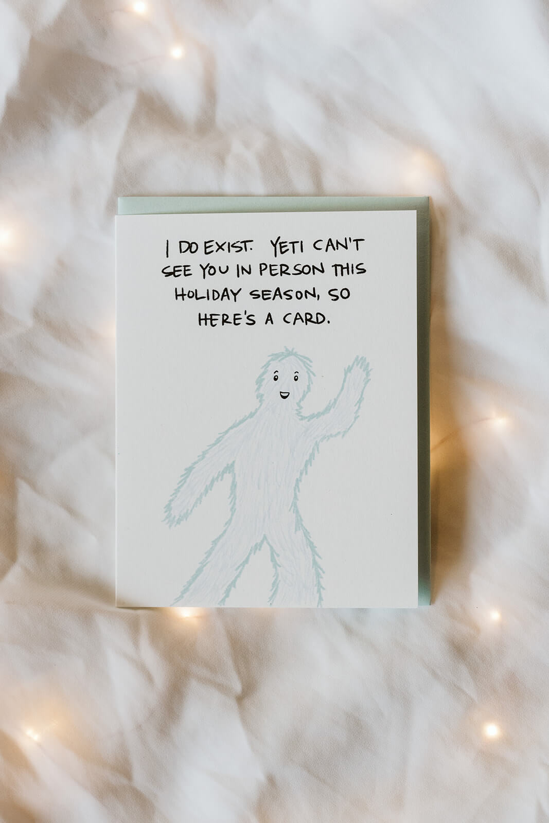 witty holiday card of a waving yet and the text "I do exist. Yeti can&
