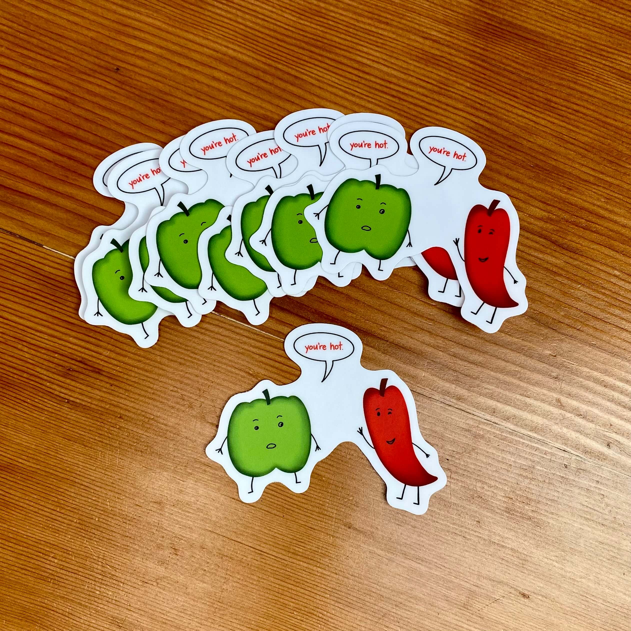 Vinyl sticker with a pair of peppers, one saying to the other, "you&