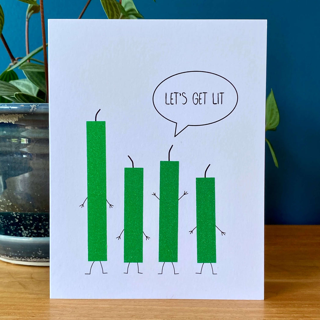 Birthday card with four green glitter candles and one candle saying, "Let&