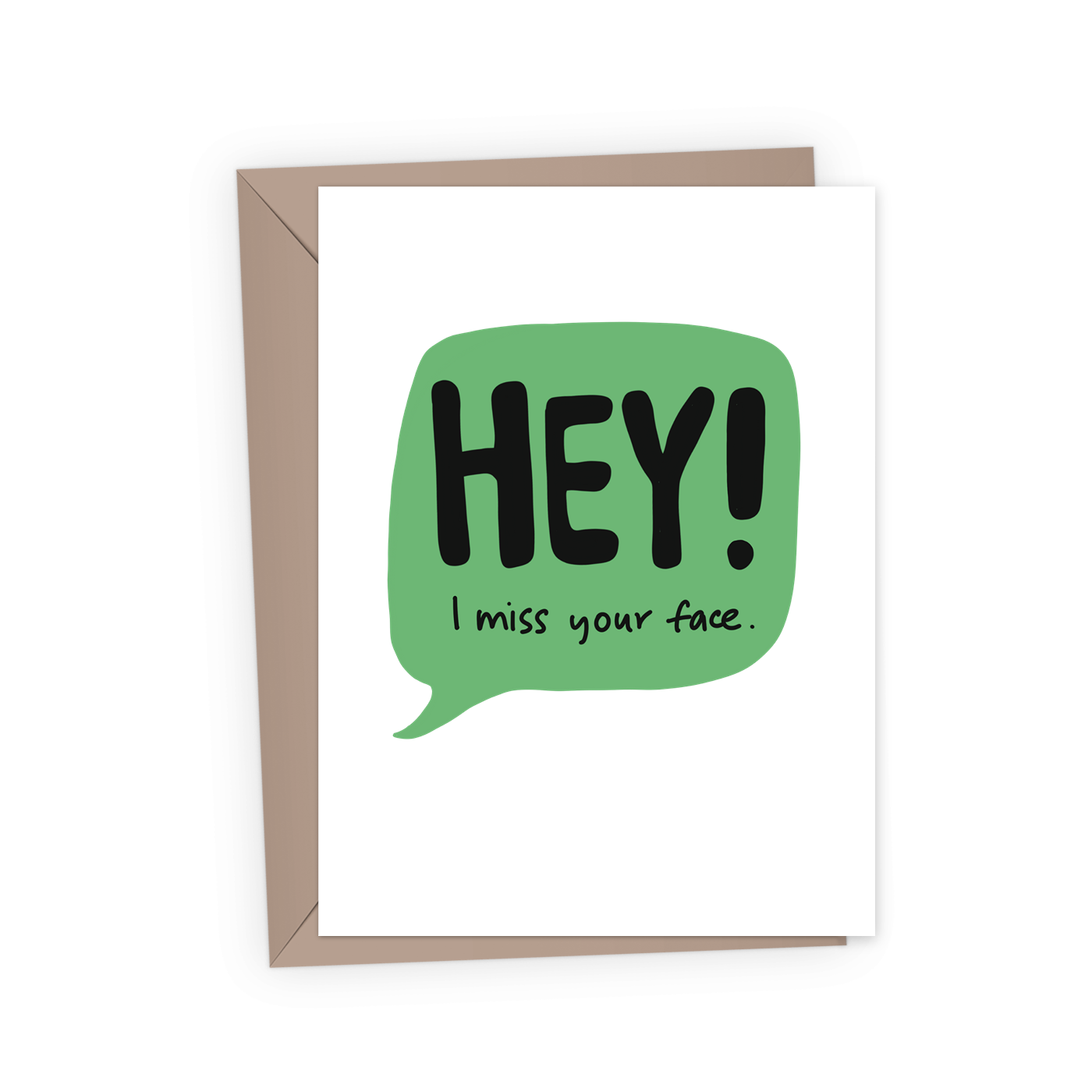 a bold, simple, funny friendship card with a green speech bubble and text, "HEY! I miss your face" against a white background, paired with a kraft envelope.