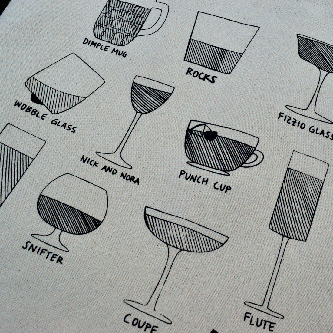 close up of line drawings of different drink glasses, printed on a canvas tote bag