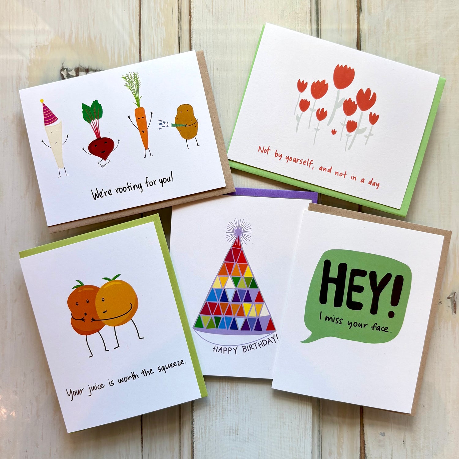 bright fun greeting cards against a wooden background