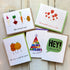 bright fun greeting cards against a wooden background
