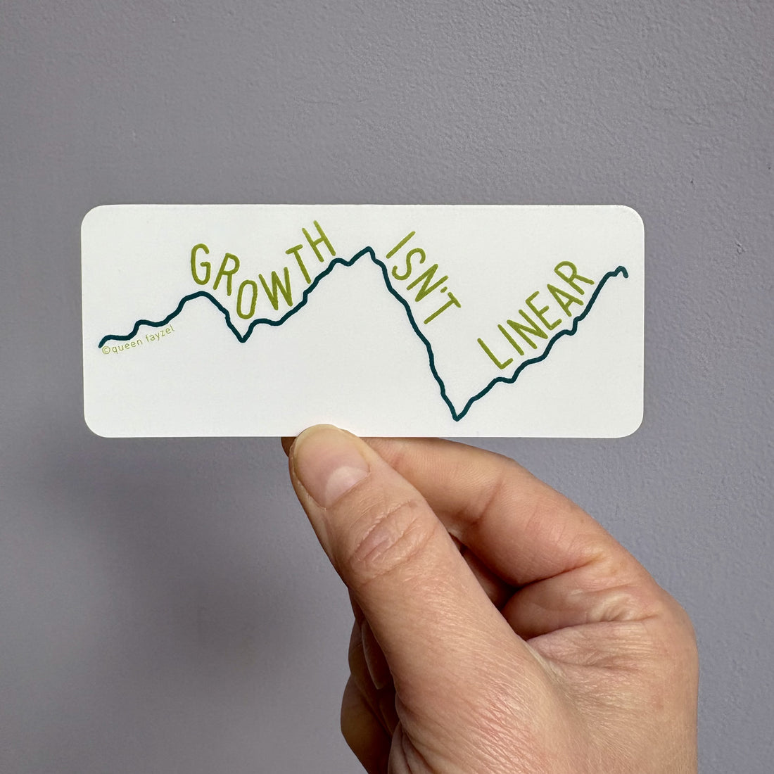 Rectangular sticker with a white background, navy graph line showing ups and downs, and the words &quot;growth isn&