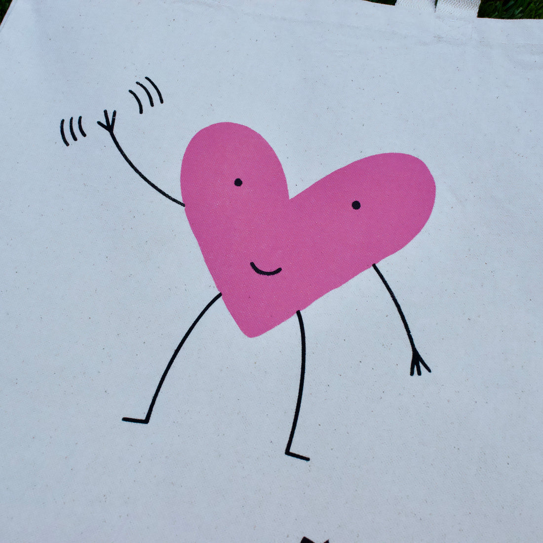 close up of a cute tote bag with waving heart design