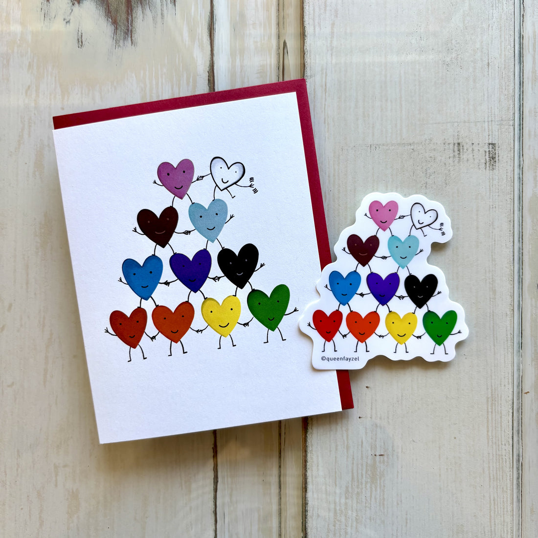 A greeting card and a sticker showing a cute pyramid of rainbow-colored hearts holding hands.