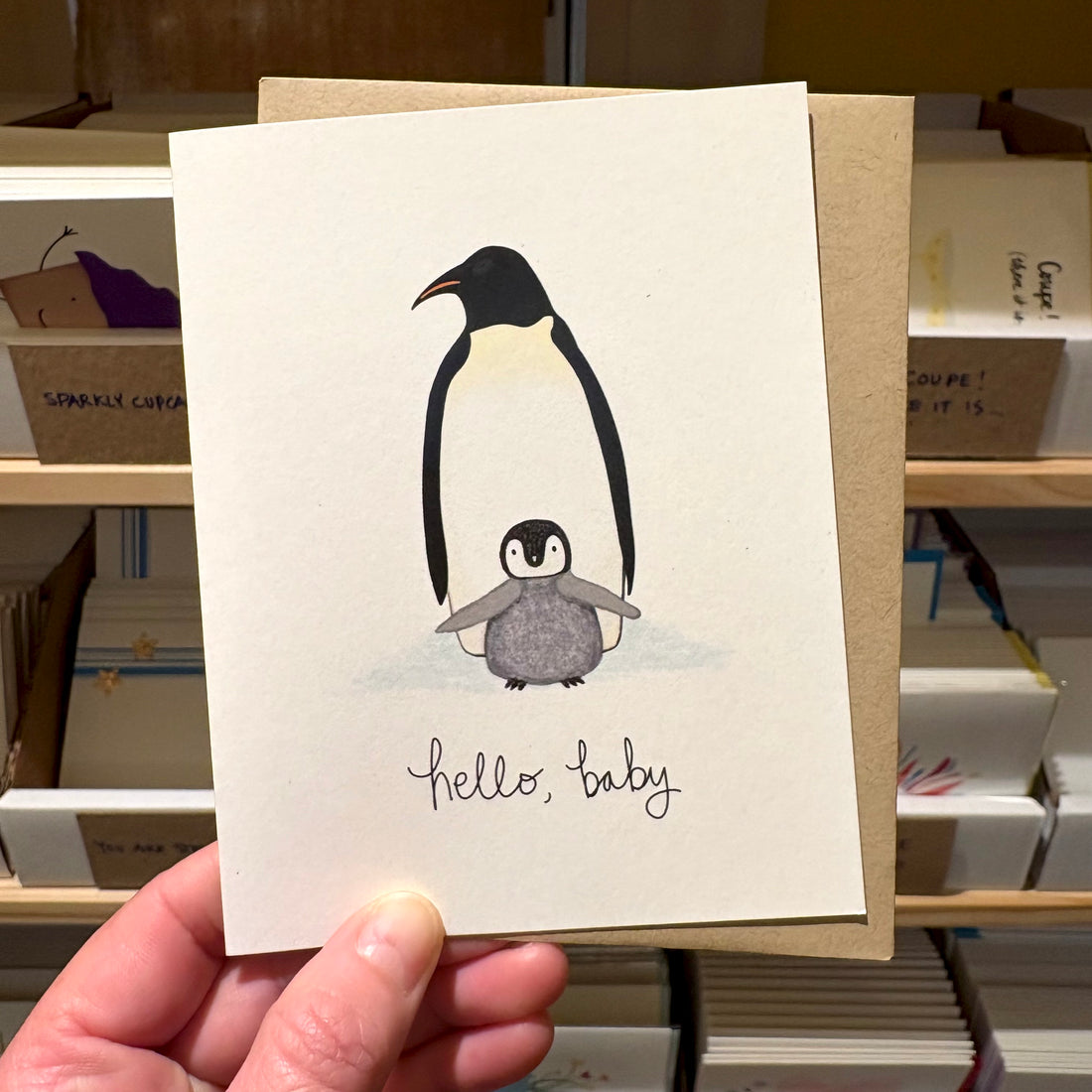 New baby card with penguin illustration and &