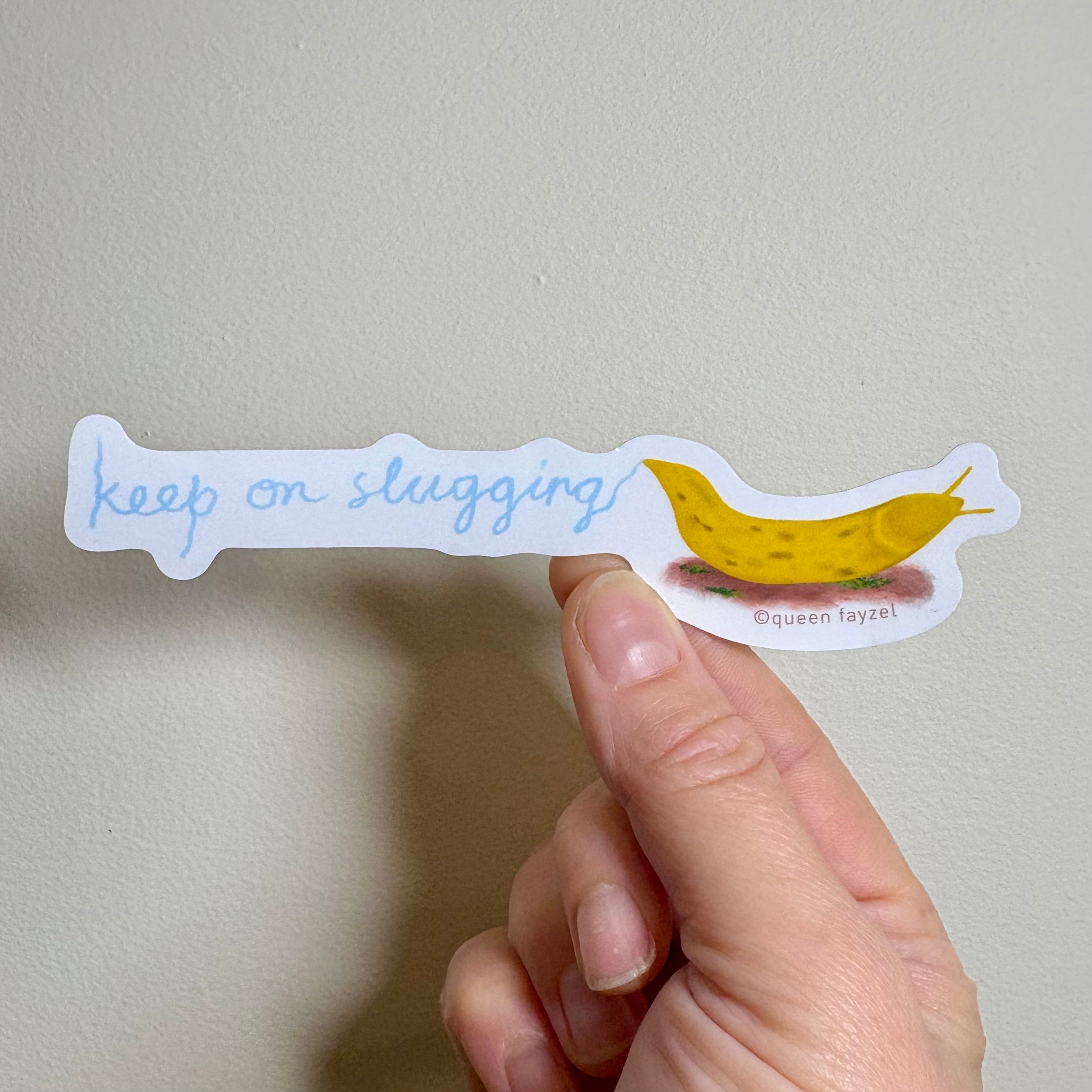 Sticker with a banana slug and &