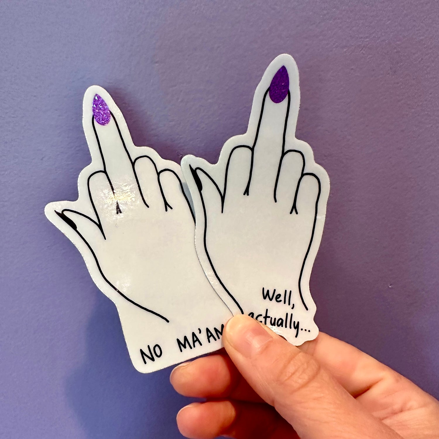 Vinyl middle finger stickers. one sticker says, "No Ma&