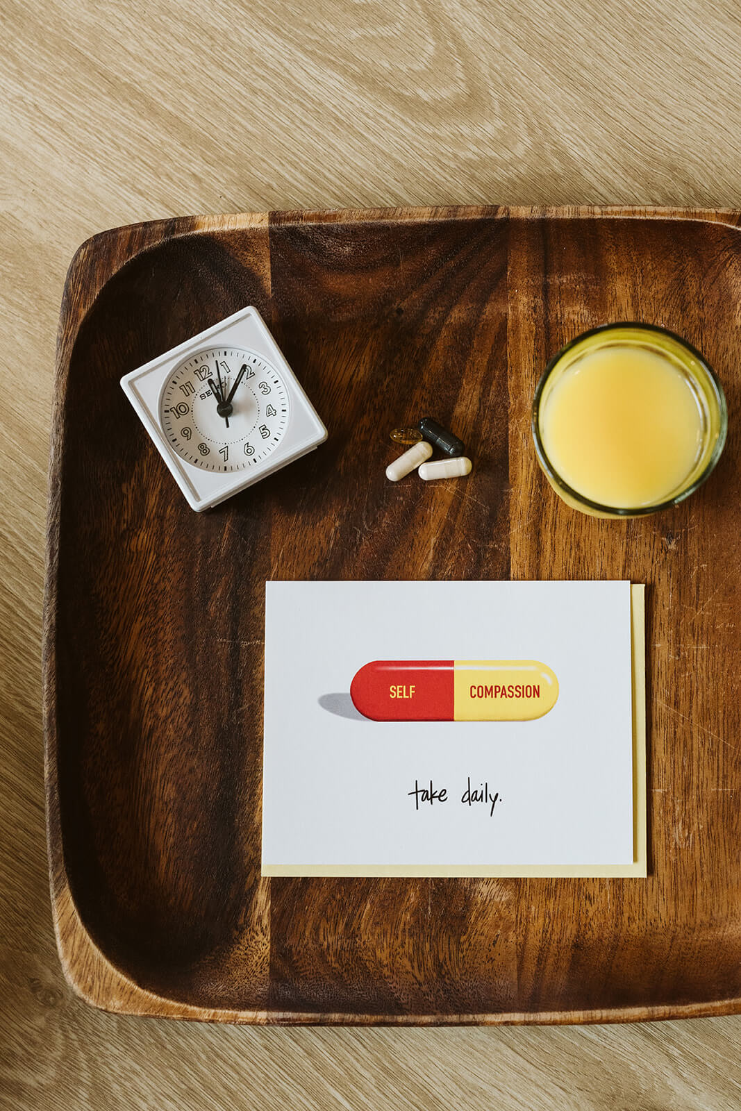 greeting card for encouragement featuring a self compassion pill and the text "take daily"