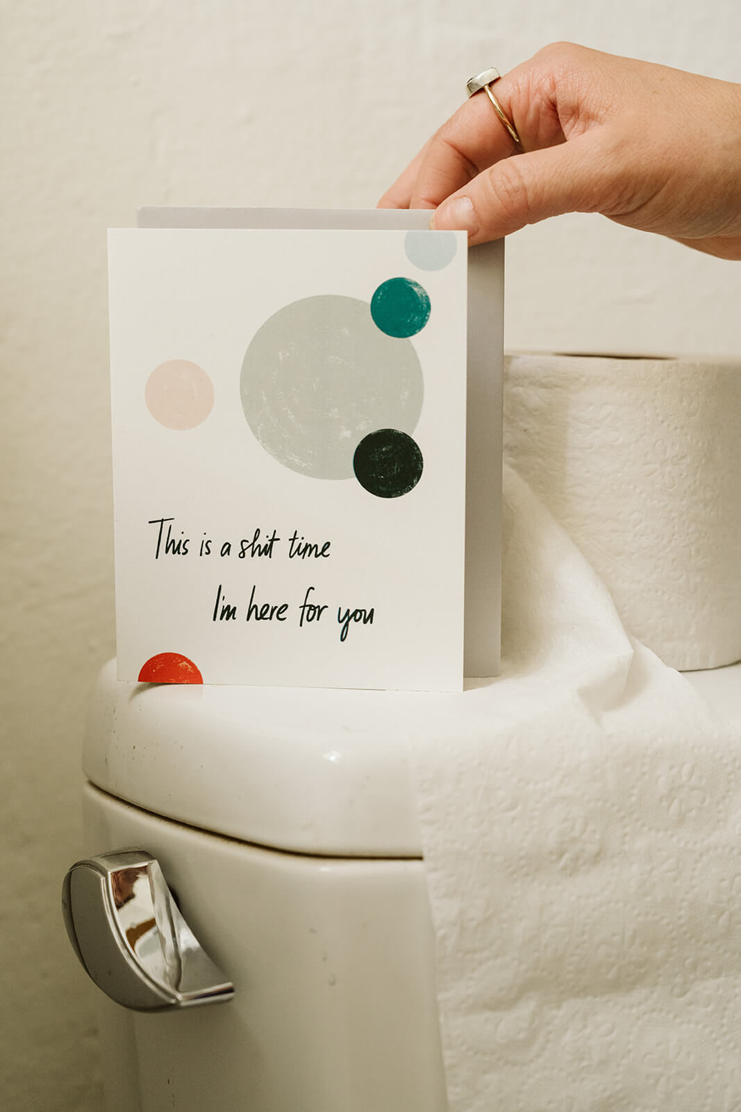 condolence card with abstract circle design and text reading &quot;This is a shit time I&