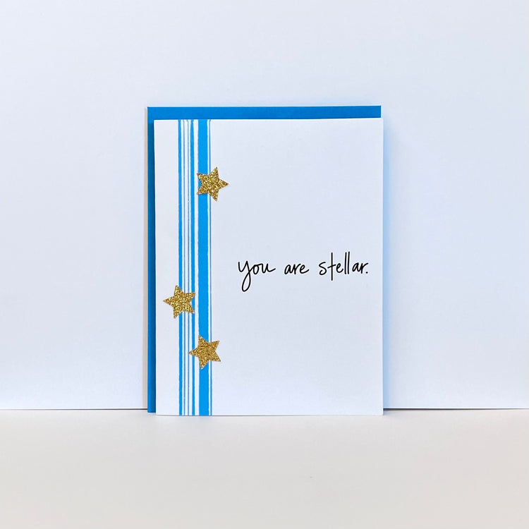 Card with teal stripes, gold stars and the words, "You are stellar"