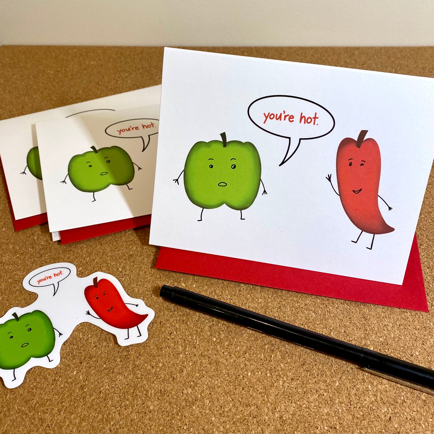 Funny, punny card with a green pepper telling a spicy pepper, "you're hot."
