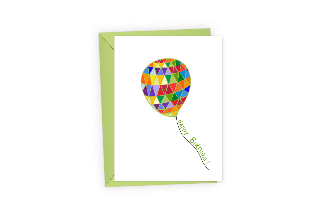 Birthday card with a rainbow balloon and the words, &quot;Happy Birthday!&quot; in green text, with a bright green envelope.