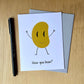 Punny, funny greeting card with a smiling bean and the words, "How you bean?" The card is next to a gray envelope and black pen.