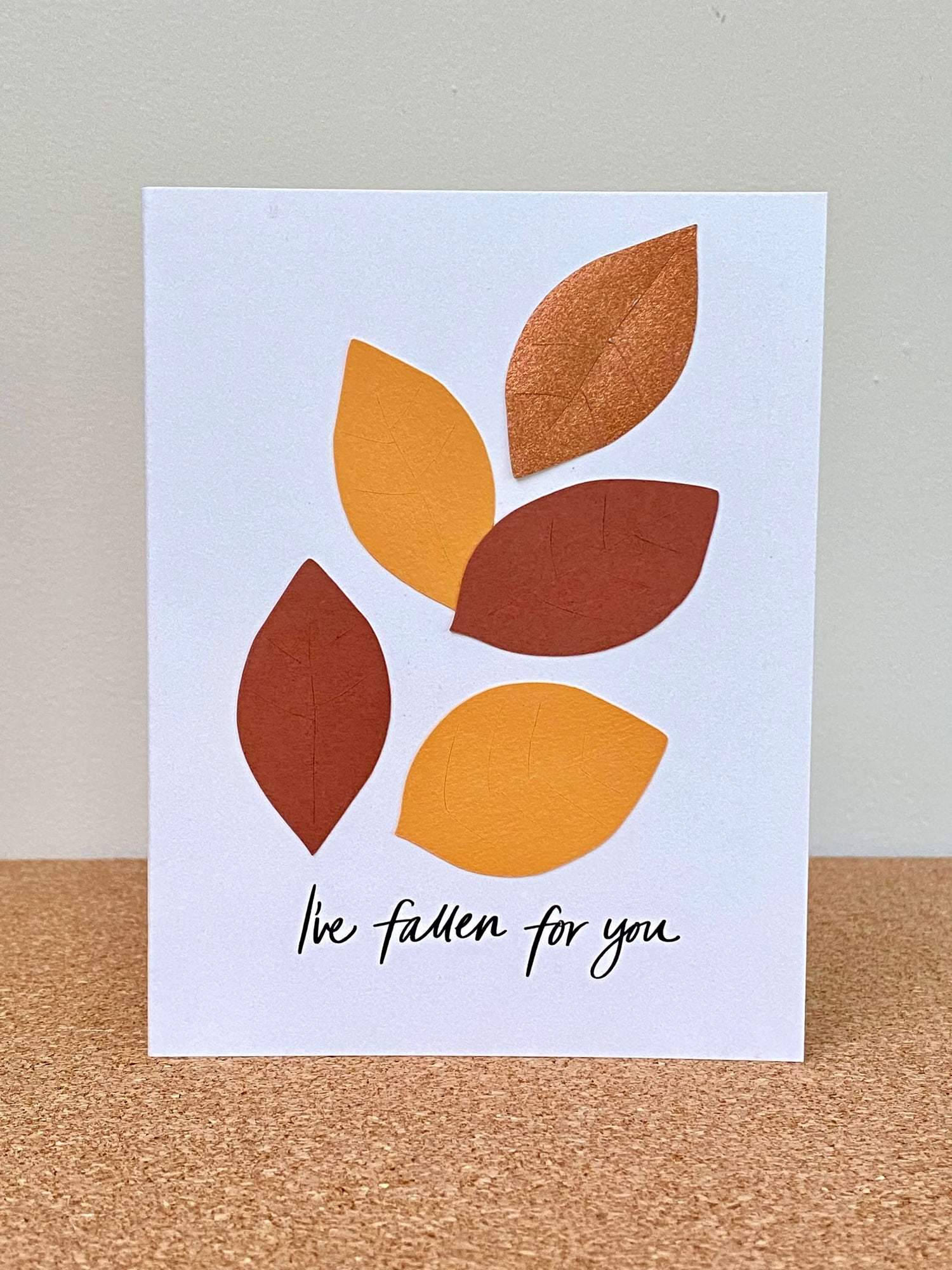 Greeting card with brown, gold, and copper leaves and the text, "I&