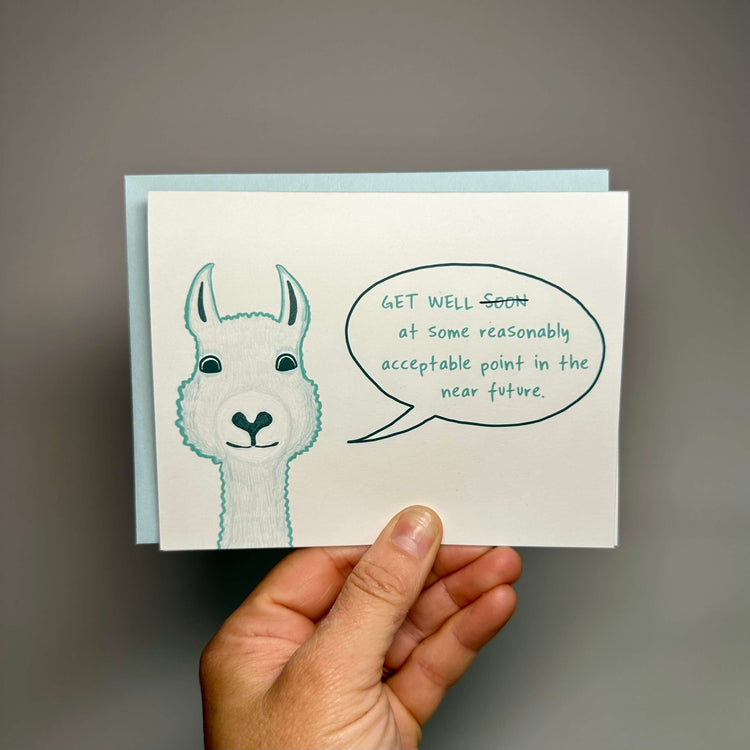 Get well card with a fuzzy llama saying, "Get well at some point in the reasonably acceptable near future."