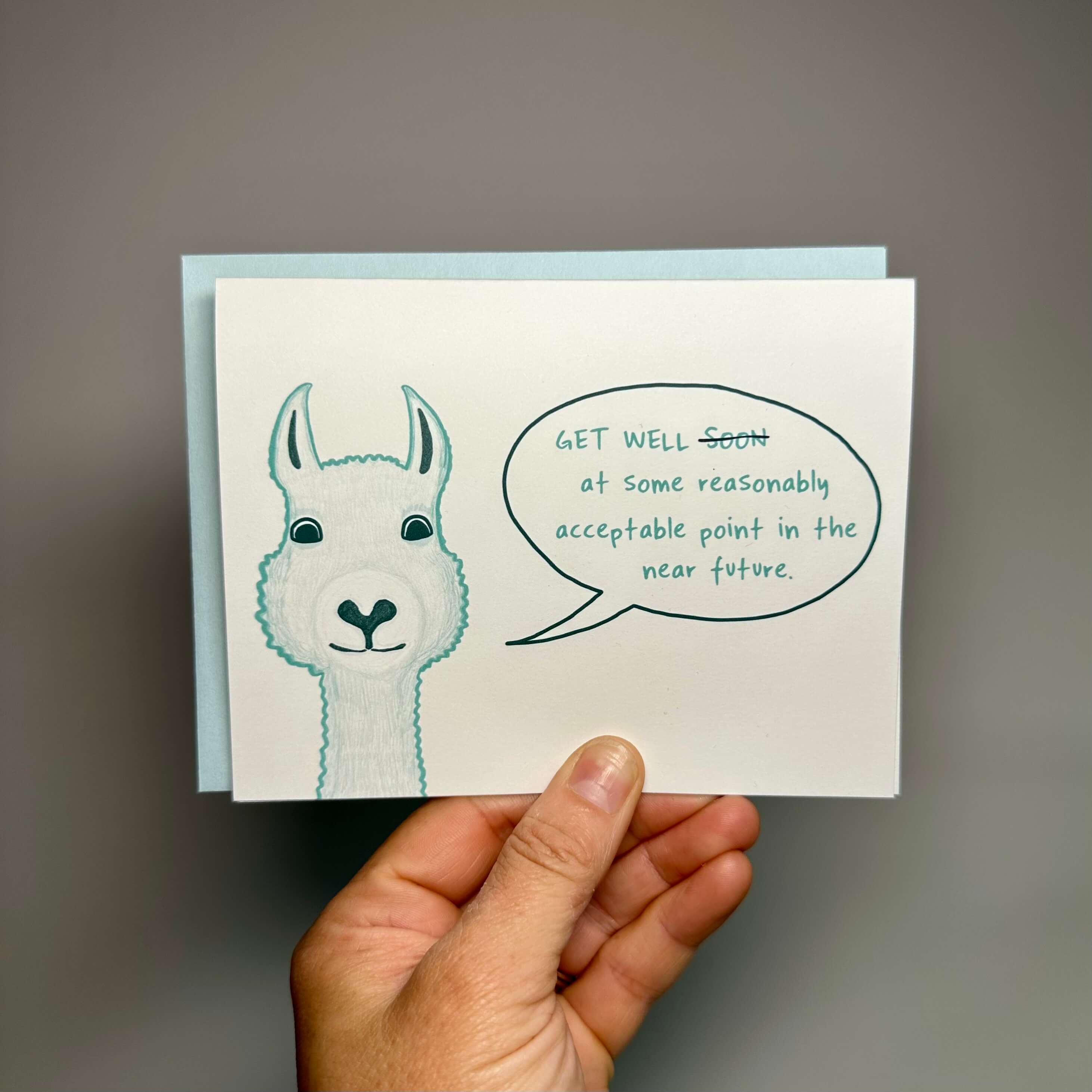 Get well card with a fuzzy llama saying, &quot;Get well at some point in the reasonably acceptable near future.&quot;